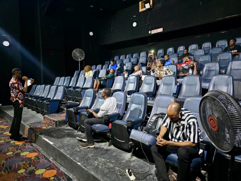 finalists for acting auditions held in August 2025 are sitting in a theatre and listening to the speaker